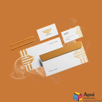 Golden envelope and stationery set by Apni Packaging.